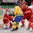 MINSK, BELARUS - MAY 10: Sweden's Calle Jarnkrok #19 reaches for a loose puck in front of Denmark's Patrick Galbraith #1 during preliminary round action at the 2014 IIHF Ice Hockey World Championship. (Photo by Richard Wolowicz/HHOF-IIHF Images)


